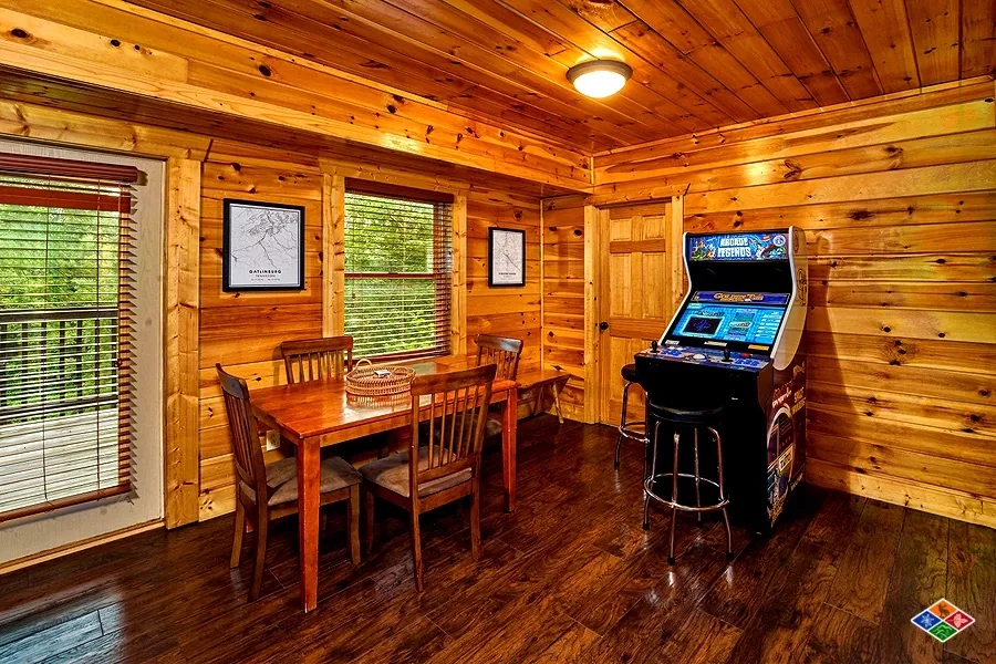 Arcade Legends cabinet and dining table in the Cowboy Way game room