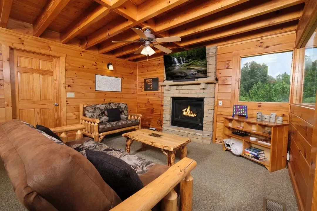 Great room at Rocky Top Retreat with a stone gas fireplace