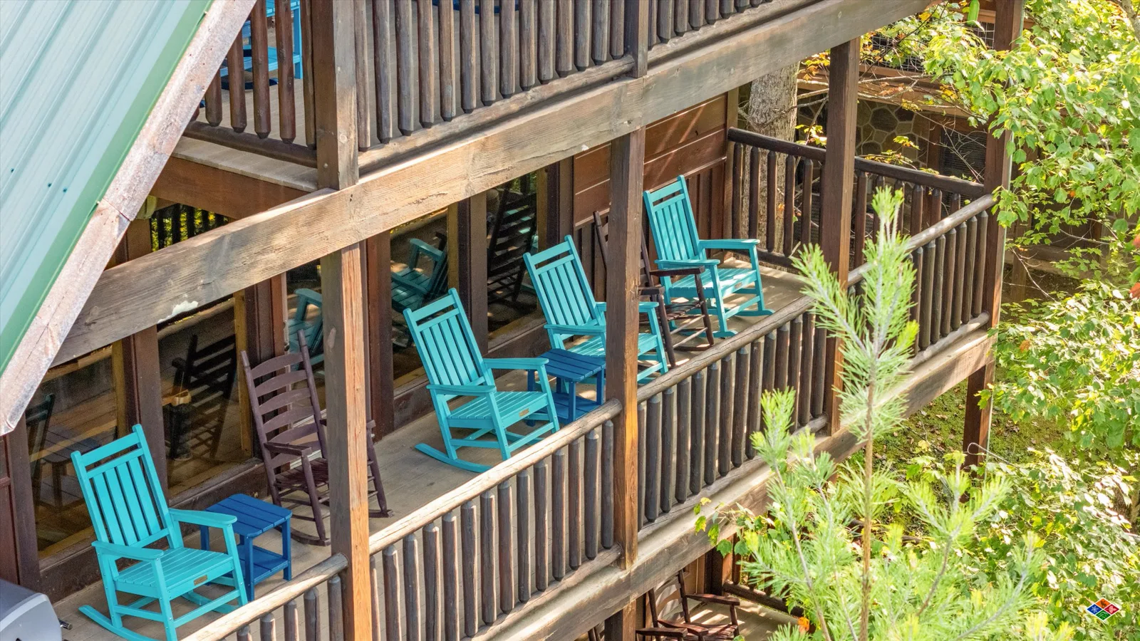 Covered decks at Summit Sanctuary with rocking chairs among the trees