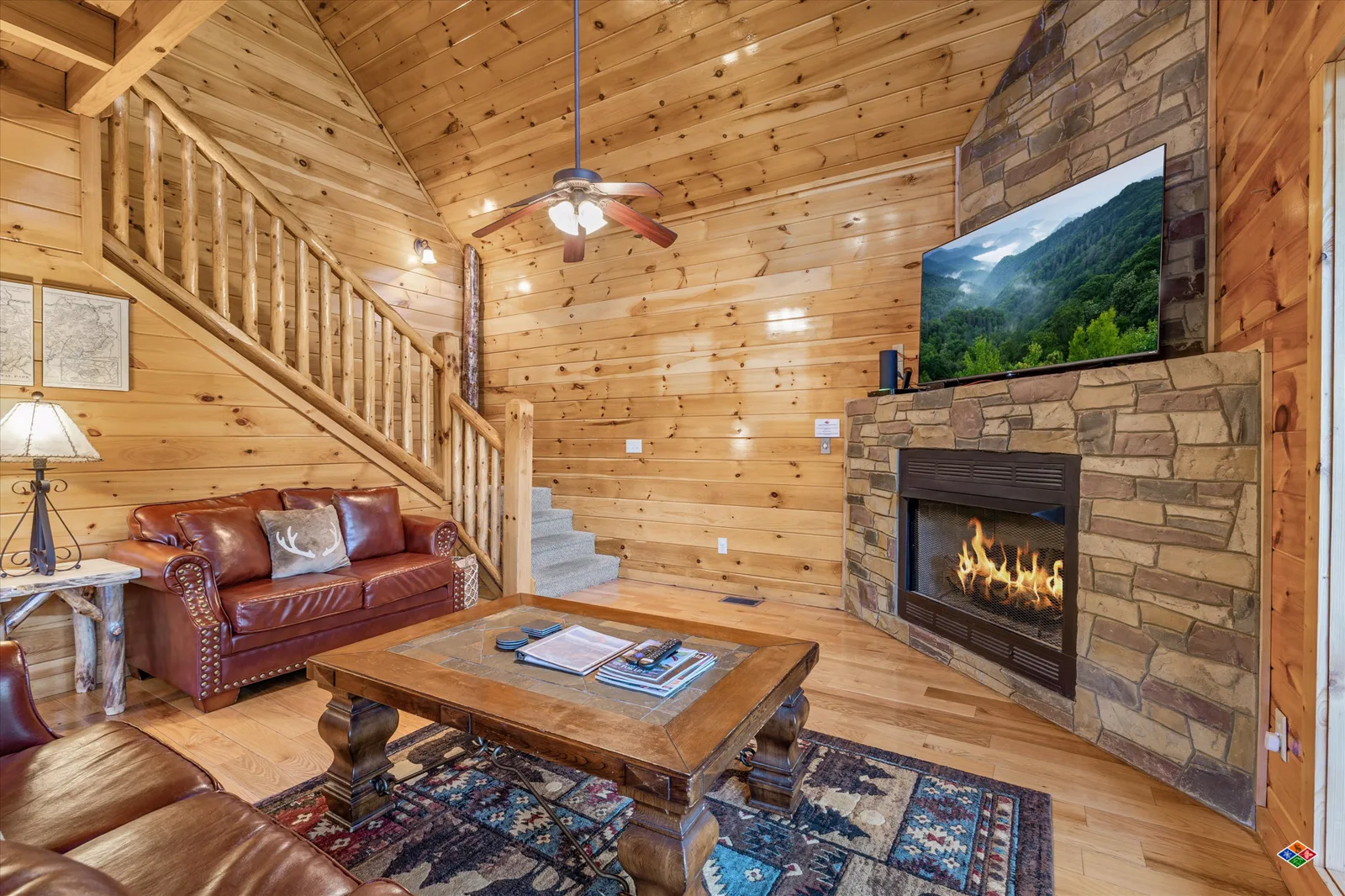 Summit Sanctuary great room with a stone gas fireplace