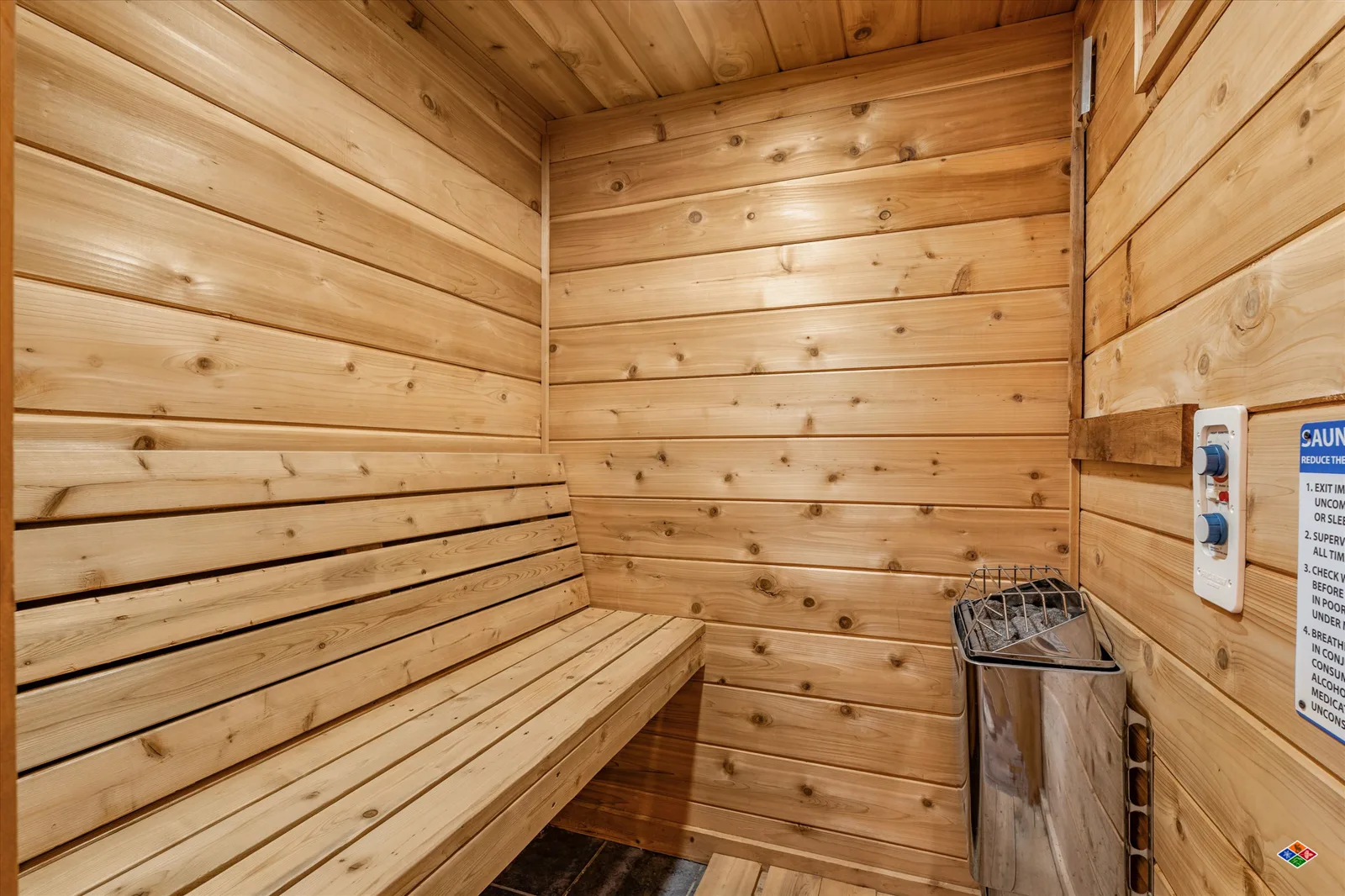 Private wood sauna at Summit Sanctuary with a stone heater