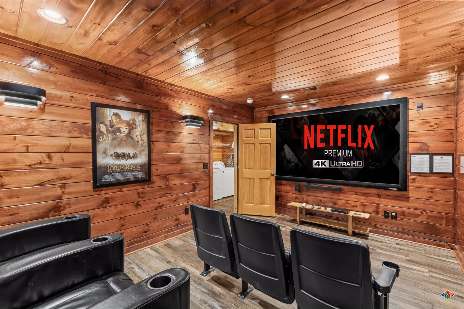Theater room at Summit Sanctuary with a projection screen and recliner seats